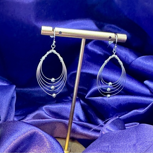 Multi Hoops with moving silver balls dangle earrings. - Picture 2 of 12